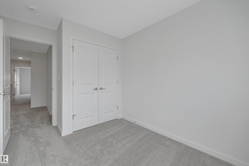 Unfurnished bedroom with carpet and a closet - 2275 Alces Drive, Edmonton, AB - Indoor Photo Showing Other Room