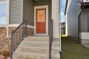 Property entrance with a yard - 2275 Alces Drive, Edmonton, AB  - Outdoor With Exterior 
