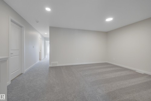 Spare room with light carpet and recessed lighting - 9104 Elves Loop, Edmonton, AB - Indoor Photo Showing Other Room