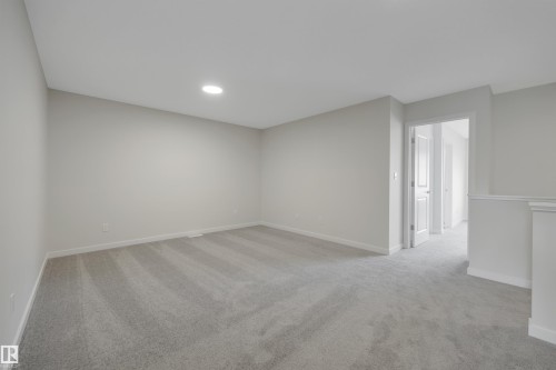 Unfurnished room with light carpet and recessed lighting - 9104 Elves Loop, Edmonton, AB - Indoor Photo Showing Other Room