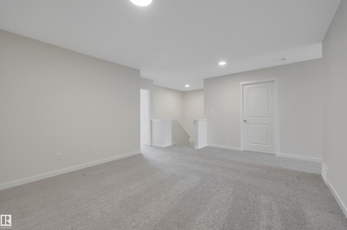 Below grade area featuring light carpet and recessed lighting - 9104 Elves Loop, Edmonton, AB - Indoor Photo Showing Other Room