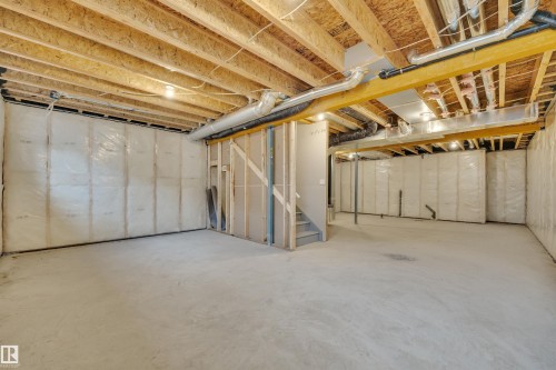 Unfinished basement with stairs - 9104 Elves Loop, Edmonton, AB - Indoor Photo Showing Basement