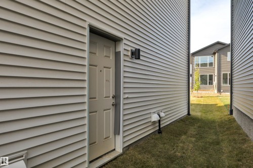 Property entrance featuring a lawn - 9104 Elves Loop, Edmonton, AB - Outdoor