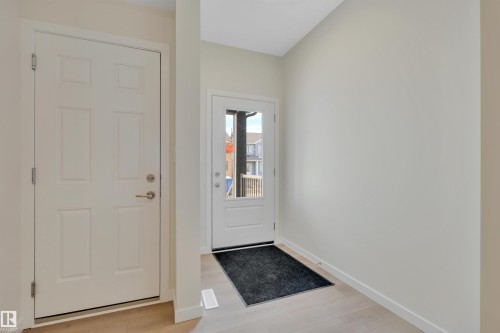 Entryway featuring wood finished floors - 9104 Elves Loop, Edmonton, AB - Indoor Photo Showing Other Room