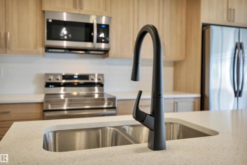 9104 Elves Loop, Edmonton, AB - Indoor Photo Showing Kitchen With Double Sink
