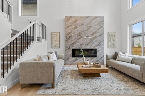 341 Roberts Wynd, Leduc, AB - Indoor Photo Showing Living Room With Fireplace