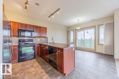 404 501 Palisades Way, Sherwood Park, AB - Indoor Photo Showing Kitchen With Double Sink