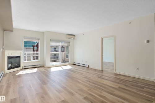 407 5 Perron Street, St. Albert, AB - Indoor Photo Showing Living Room With Fireplace
