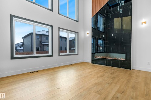 733 Astoria Way, Devon, AB - Indoor Photo Showing Other Room With Fireplace