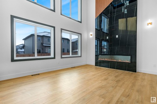 745 Astoria Way, Devon, AB - Indoor Photo Showing Other Room With Fireplace