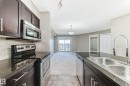 418 3315 James Mowatt Trail, Edmonton, AB  - Indoor Photo Showing Kitchen With Stainless Steel Kitchen With Double Sink 