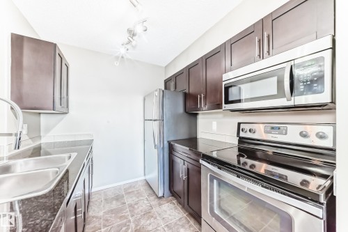 418 3315 James Mowatt Trail, Edmonton, AB - Indoor Photo Showing Kitchen With Stainless Steel Kitchen With Double Sink