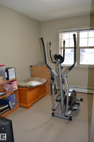 111 11445 Ellerslie Road, Edmonton, AB - Indoor Photo Showing Gym Room
