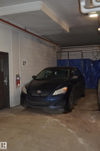 111 11445 Ellerslie Road, Edmonton, AB - Indoor Photo Showing Garage