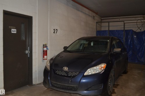111 11445 Ellerslie Road, Edmonton, AB - Indoor Photo Showing Garage