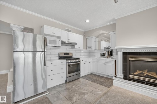 16103 89 Street, Edmonton, AB - Indoor Photo Showing Kitchen With Fireplace