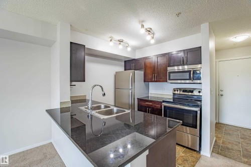 108 5810 Mullen Place, Edmonton, AB - Indoor Photo Showing Kitchen With Double Sink With Upgraded Kitchen
