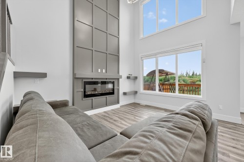 86 Meadowlink Common, Spruce Grove, AB - Indoor Photo Showing Living Room With Fireplace