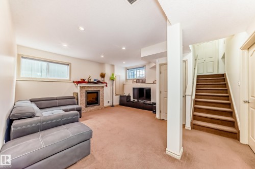 1443 37C Avenue, Edmonton, AB - Indoor Photo Showing Other Room With Fireplace