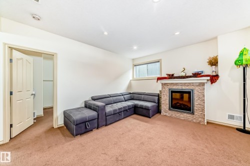 1443 37C Avenue, Edmonton, AB - Indoor Photo Showing Other Room With Fireplace