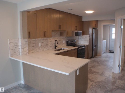 4418 55 Avenue, Barrhead, AB - Indoor Photo Showing Kitchen With Double Sink