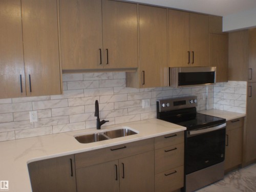 4418 55 Avenue, Barrhead, AB - Indoor Photo Showing Kitchen With Double Sink