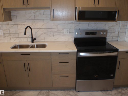 4418 55 Avenue, Barrhead, AB - Indoor Photo Showing Kitchen With Double Sink