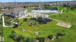 Aerial perspective of suburban area with a community park - 