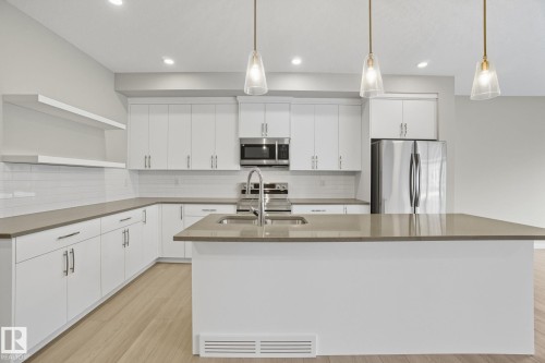 9102 Elves Loop Nw, Edmonton, AB - Indoor Photo Showing Kitchen With Upgraded Kitchen