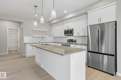 9102 Elves Loop Nw, Edmonton, AB - Indoor Photo Showing Kitchen With Upgraded Kitchen