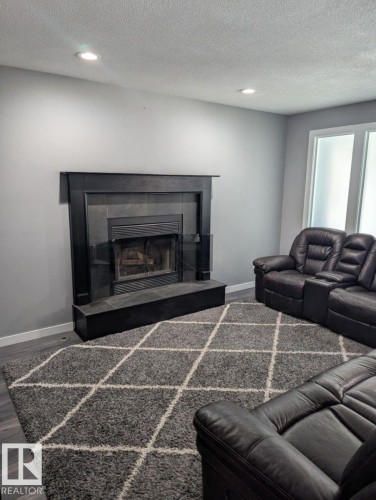 11019 10 Avenue, Edmonton, AB - Indoor Photo Showing Living Room With Fireplace