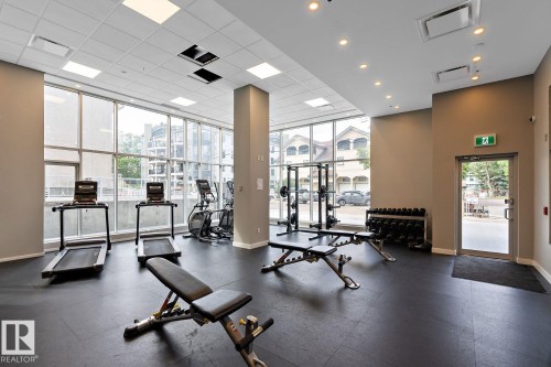 Workout area with a city view and a high drop ceiling - 9922 111 Street, Edmonton, AB - Indoor Photo Showing Gym Room