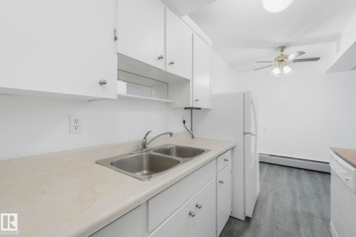 306 8310 Jasper Avenue, Edmonton, AB - Indoor Photo Showing Kitchen With Double Sink