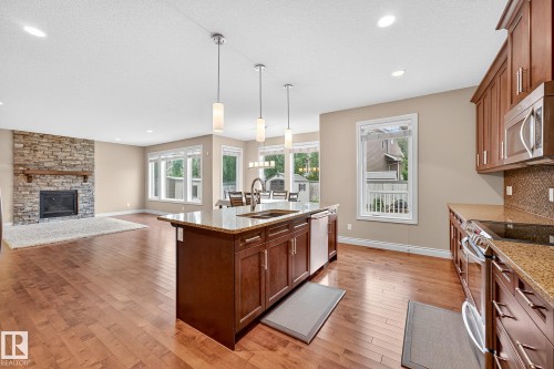 2121 90A Street, Edmonton, AB - Indoor Photo Showing Kitchen With Fireplace With Double Sink