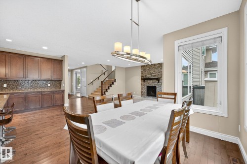 2121 90A Street, Edmonton, AB - Indoor Photo Showing Dining Room With Fireplace