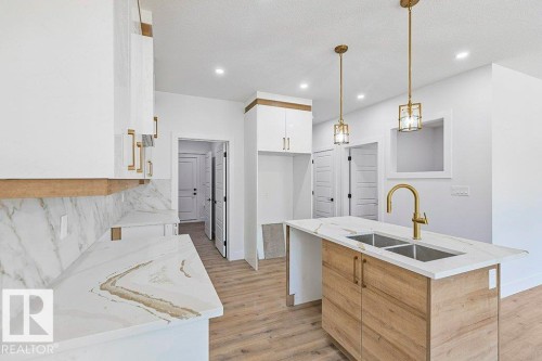 65 Silverstone Drive, Stony Plain, AB - Indoor Photo Showing Kitchen With Double Sink