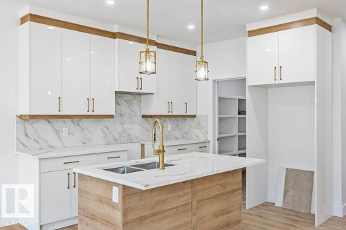 65 Silverstone Drive, Stony Plain, AB - Indoor Photo Showing Kitchen With Double Sink