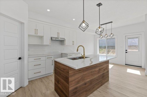 65 Silverstone Drive, Stony Plain, AB - Indoor Photo Showing Kitchen With Double Sink With Upgraded Kitchen