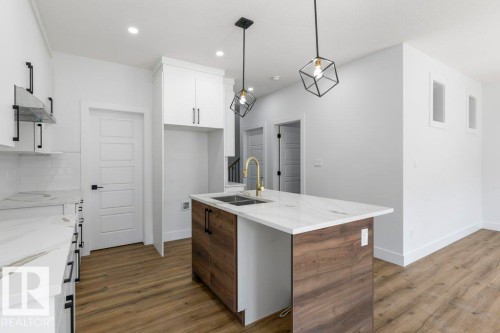 65 Silverstone Drive, Stony Plain, AB - Indoor Photo Showing Kitchen With Double Sink