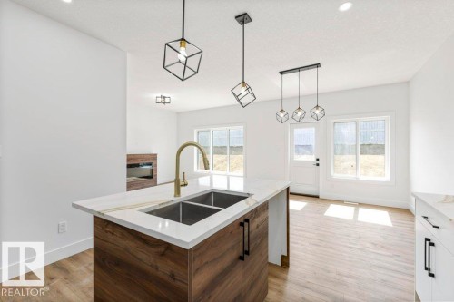 65 Silverstone Drive, Stony Plain, AB - Indoor Photo Showing Kitchen With Double Sink