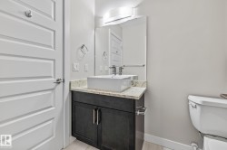 Half bathroom featuring toilet and vanity - 