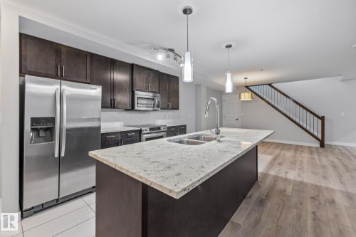 810 5151 Windermere Boulevard, Edmonton, AB - Indoor Photo Showing Kitchen With Stainless Steel Kitchen With Double Sink With Upgraded Kitchen
