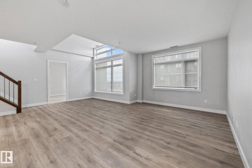 810 5151 Windermere Boulevard, Edmonton, AB - Indoor Photo Showing Other Room
