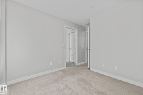 810 5151 Windermere Boulevard, Edmonton, AB - Indoor Photo Showing Other Room