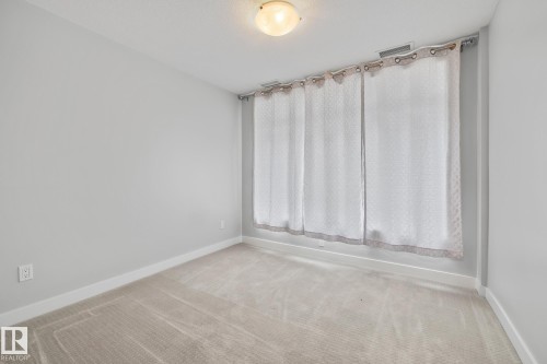 810 5151 Windermere Boulevard, Edmonton, AB - Indoor Photo Showing Other Room