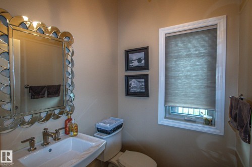 Bathroom with a sink and toilet - 5753 43 Ave, St. Paul Town, AB - Indoor Photo Showing Bathroom