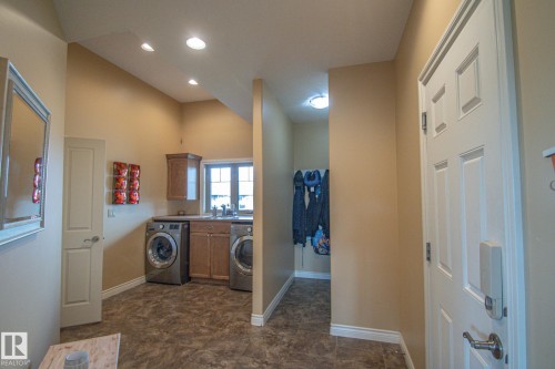 Laundry area with recessed lighting and cabinet space - 5753 43 Ave, St. Paul Town, AB - Indoor Photo Showing Laundry Room