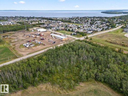 Aerial view of property's location featuring a nearby body of water and nearby suburban area - 1701 16 Street, Cold Lake, AB 