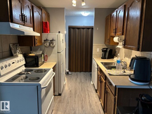 209 5705 51 Street, Elk Point, AB - Indoor Photo Showing Kitchen With Double Sink