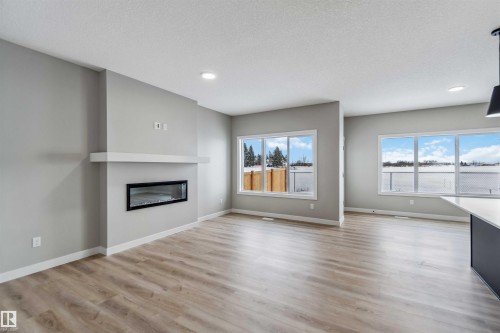 1659 12 Street, Edmonton, AB - Indoor Photo Showing Living Room With Fireplace